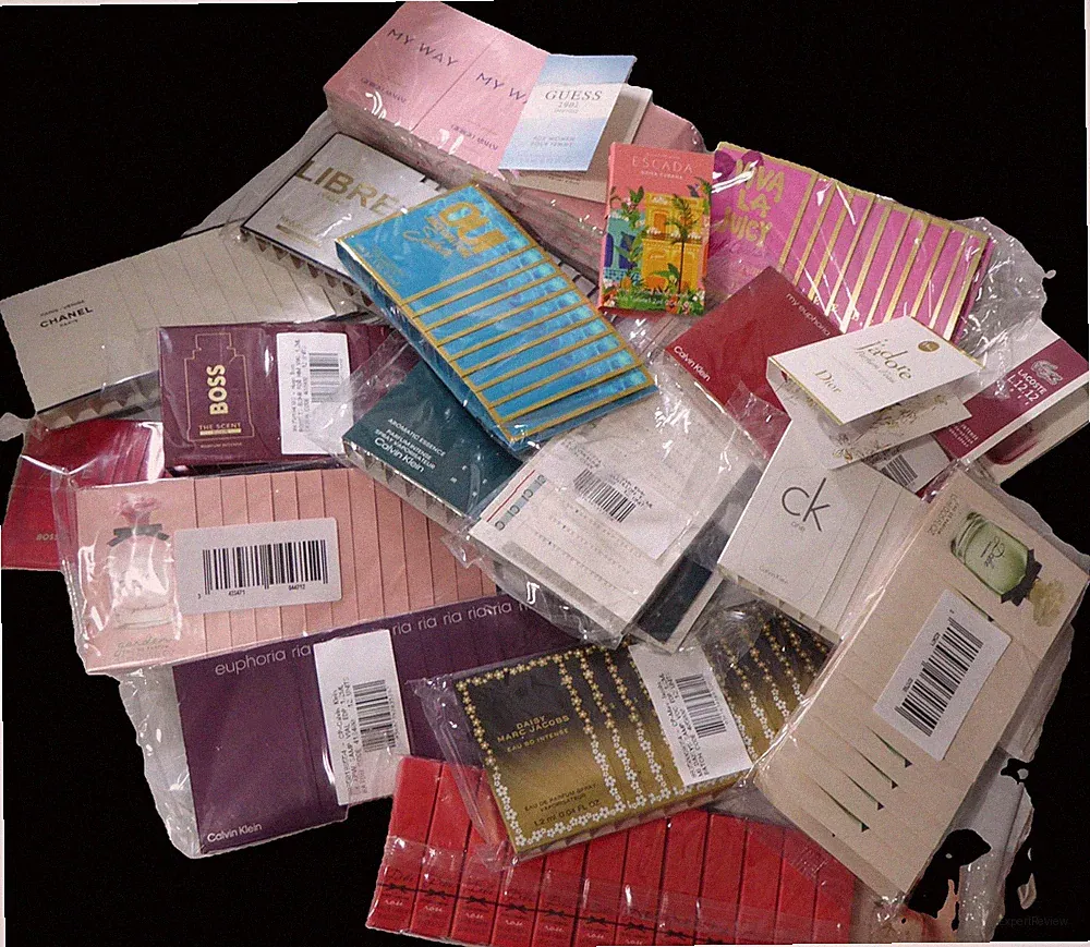 JUST ARRIVED 100 DESIGNER PERFUMES YOU GET 5 DIFFERENT SCENTS 20 EA .64 EA=100